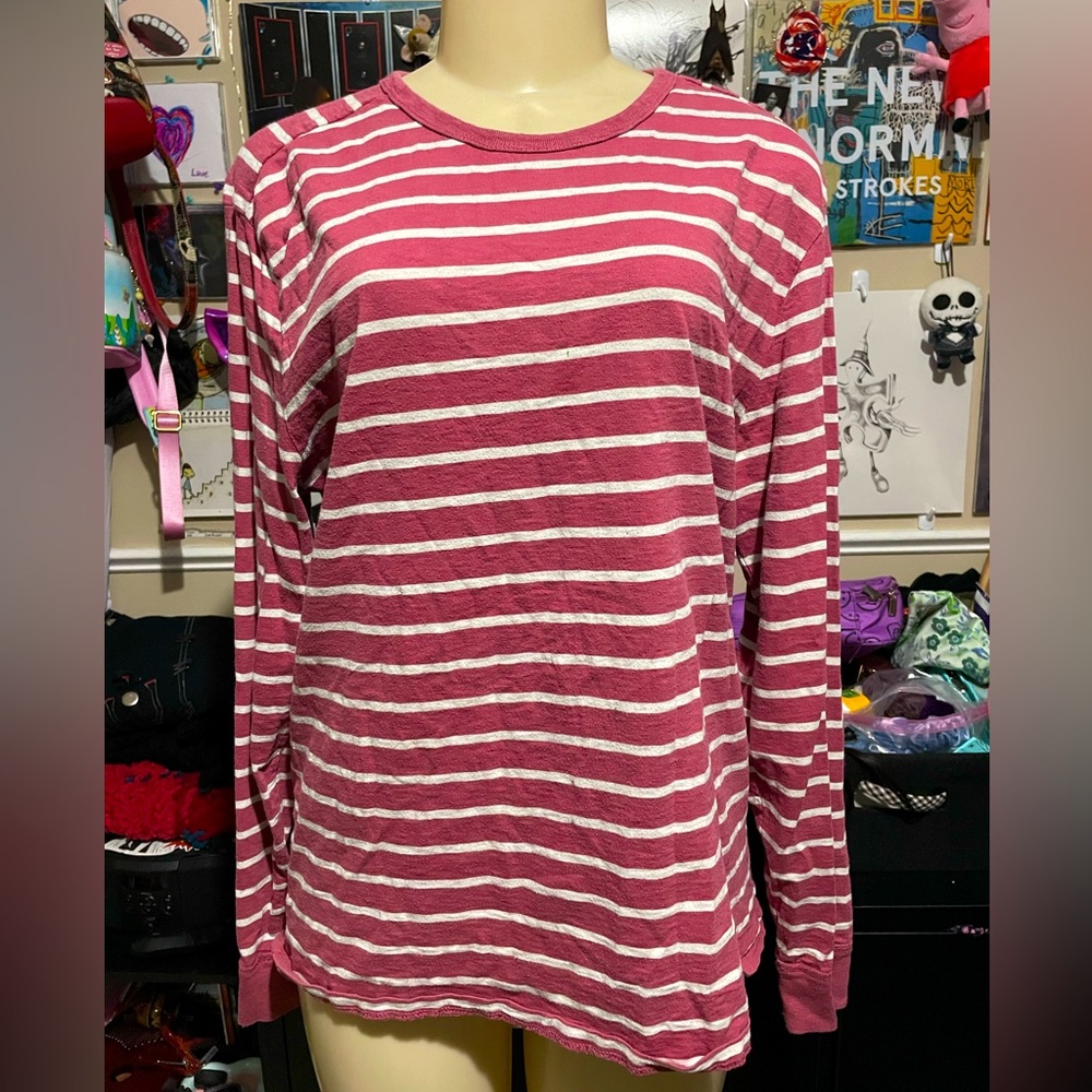 pink and white long sleeve shirt